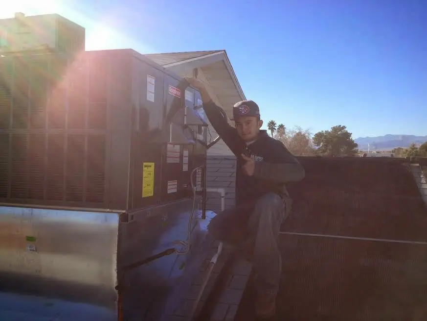 HVAC technician performing HVAC Inspection on a rooftop unit in Nether Providence